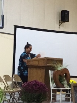 Community Chest staff member Farah Rashdan reads her poem "The Desert People"